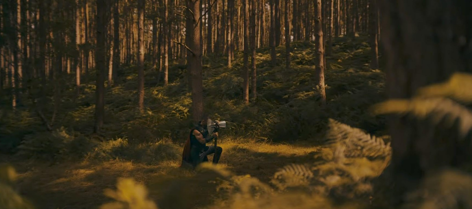 A dramatic, high-stakes moment from Avengers: Doomsday, featuring powerful heroes poised for battle amid chaos and looming destruction in a dark, apocalyptic setting. top Hollywood movies 2026