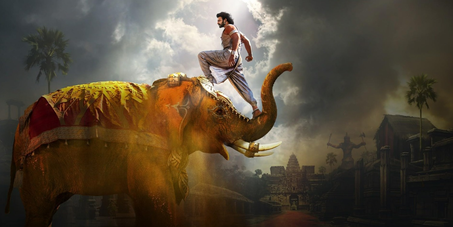 Official poster of Baahubali 2: The Conclusion featuring Prabhas in a royal warrior look.