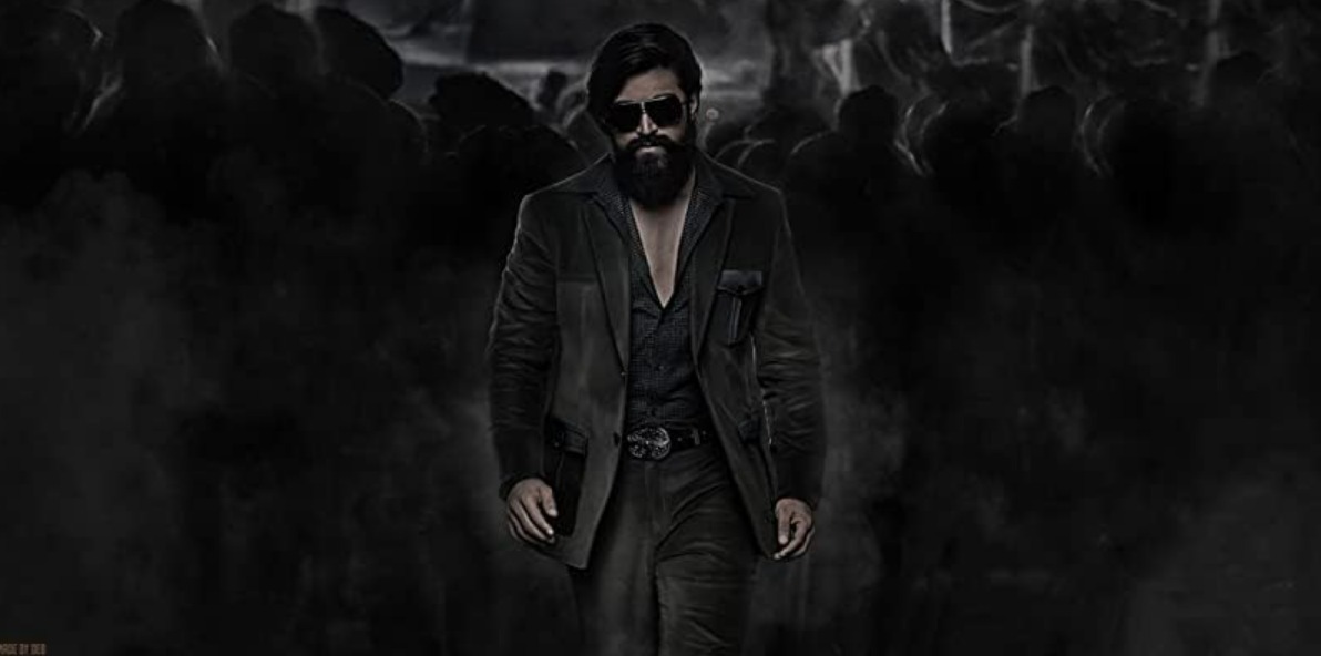 Official poster of K.G.F: Chapter 2 featuring Yash as Rocky Bhai in a powerful mass avatar.