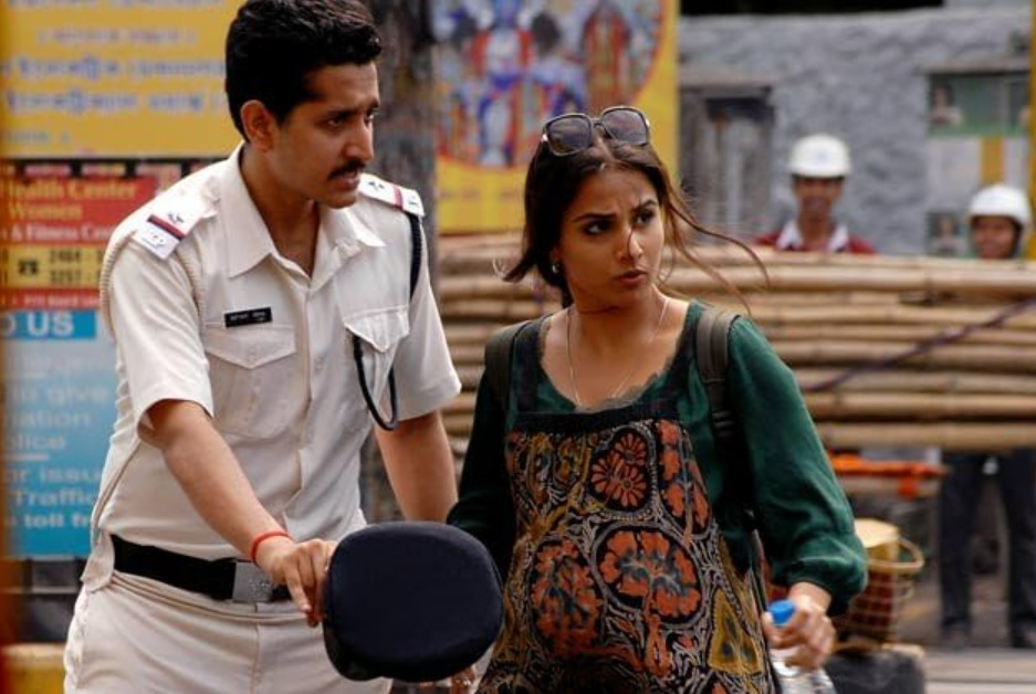 A mysterious scene from Kahaani showing a pregnant woman navigating the crowded streets of Kolkata amid a tense search, reflecting the film’s suspenseful, investigative, and unpredictable thriller tone.