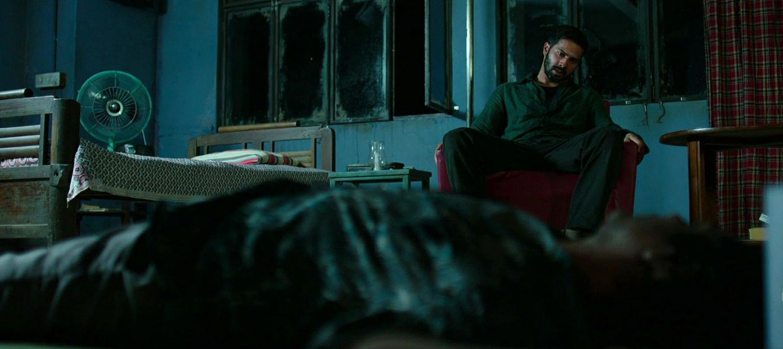 A dark, intense moment from Badlapur showing a man consumed by revenge, reflecting the film’s gritty, unsettling, and morally complex thriller atmosphere.