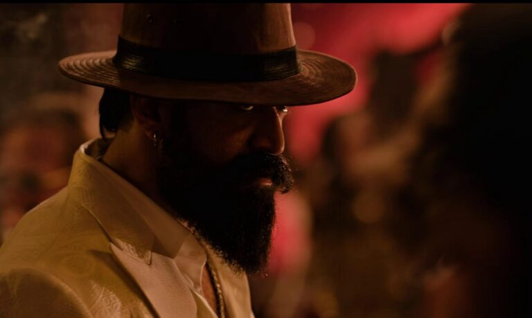 A gritty, high-intensity moment from Toxic, showcasing a dark, stylish atmosphere with a commanding character presence and a tense, action-driven mood. upcoming Bollywood movies 2026